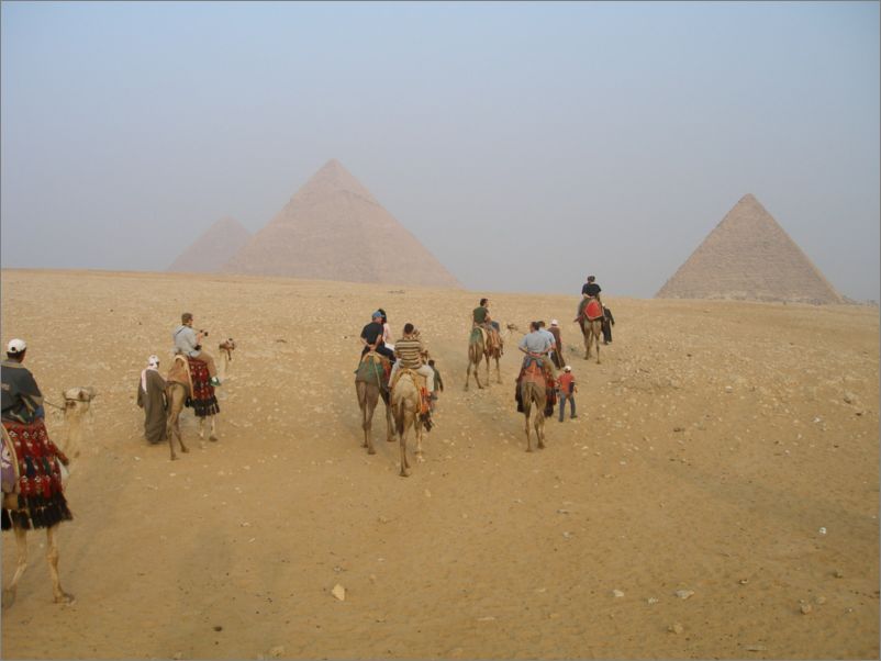 Crew on camels on way to the Pyramids